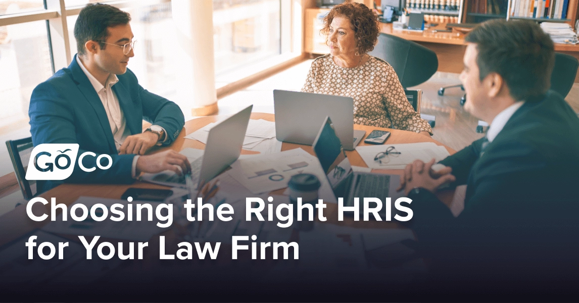 Three lawyers working together at a conference table.