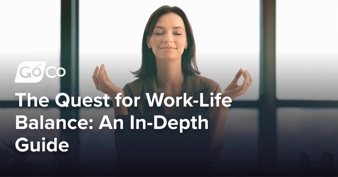 A woman meditating at her desk.