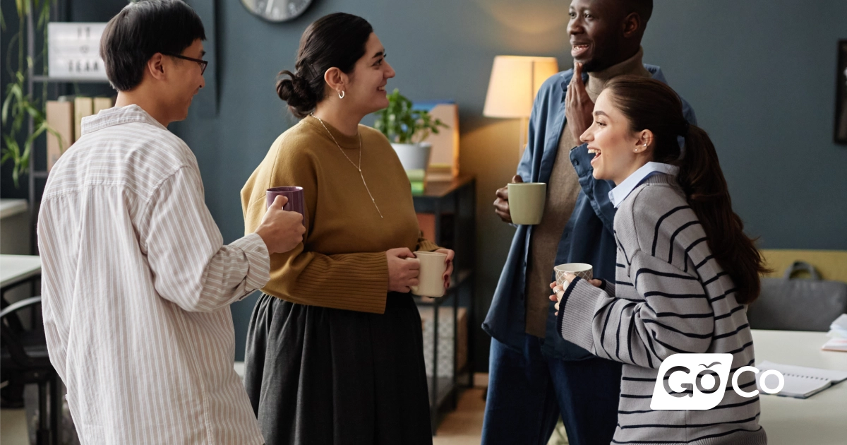 a group of people standing around a table